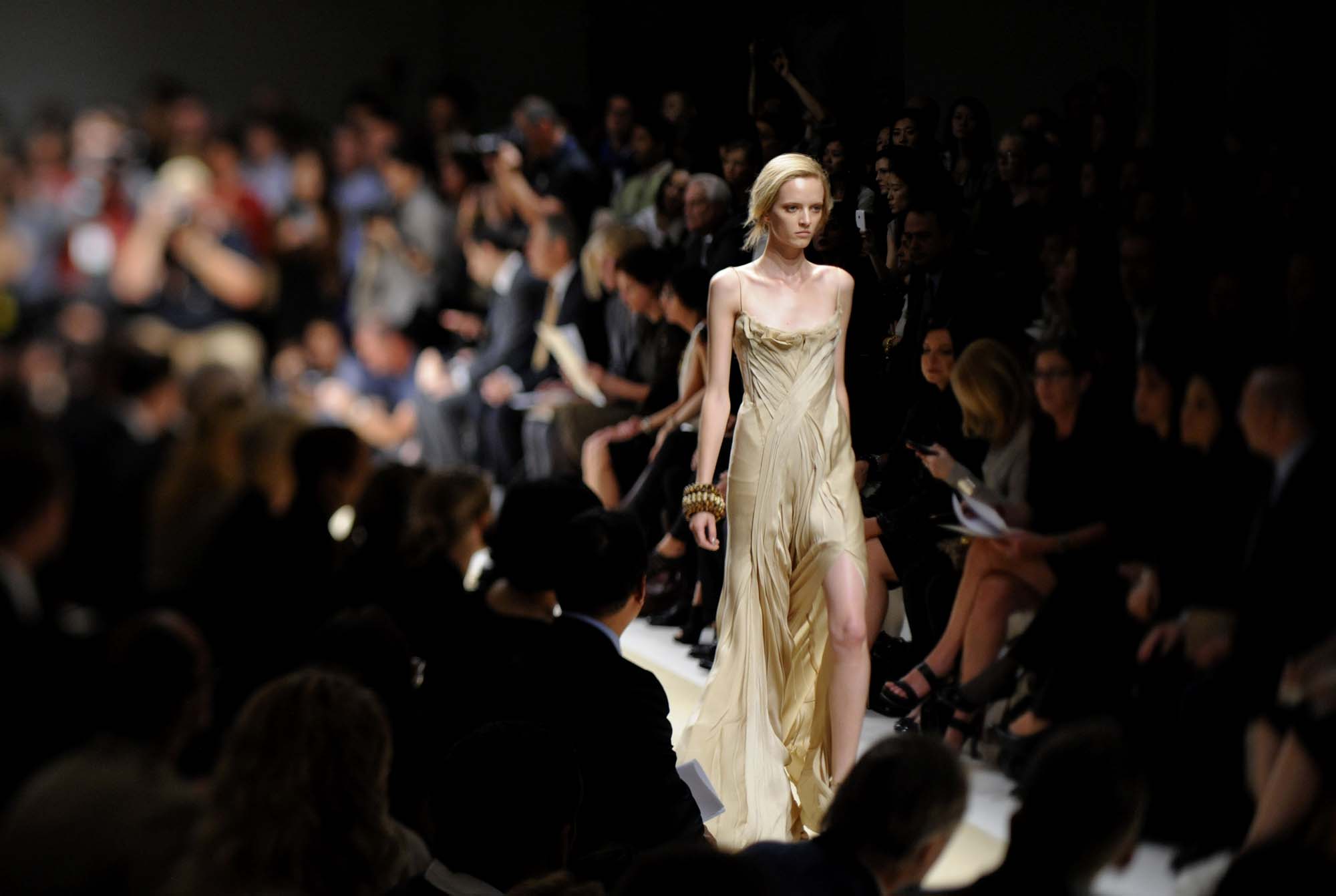 A model walks the runway in designs by Donna Karan at her fashion show